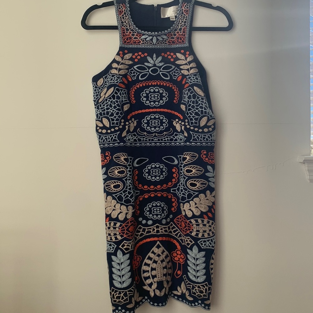 Navy blue embroidered dress. Knee-length on me (5’6”)